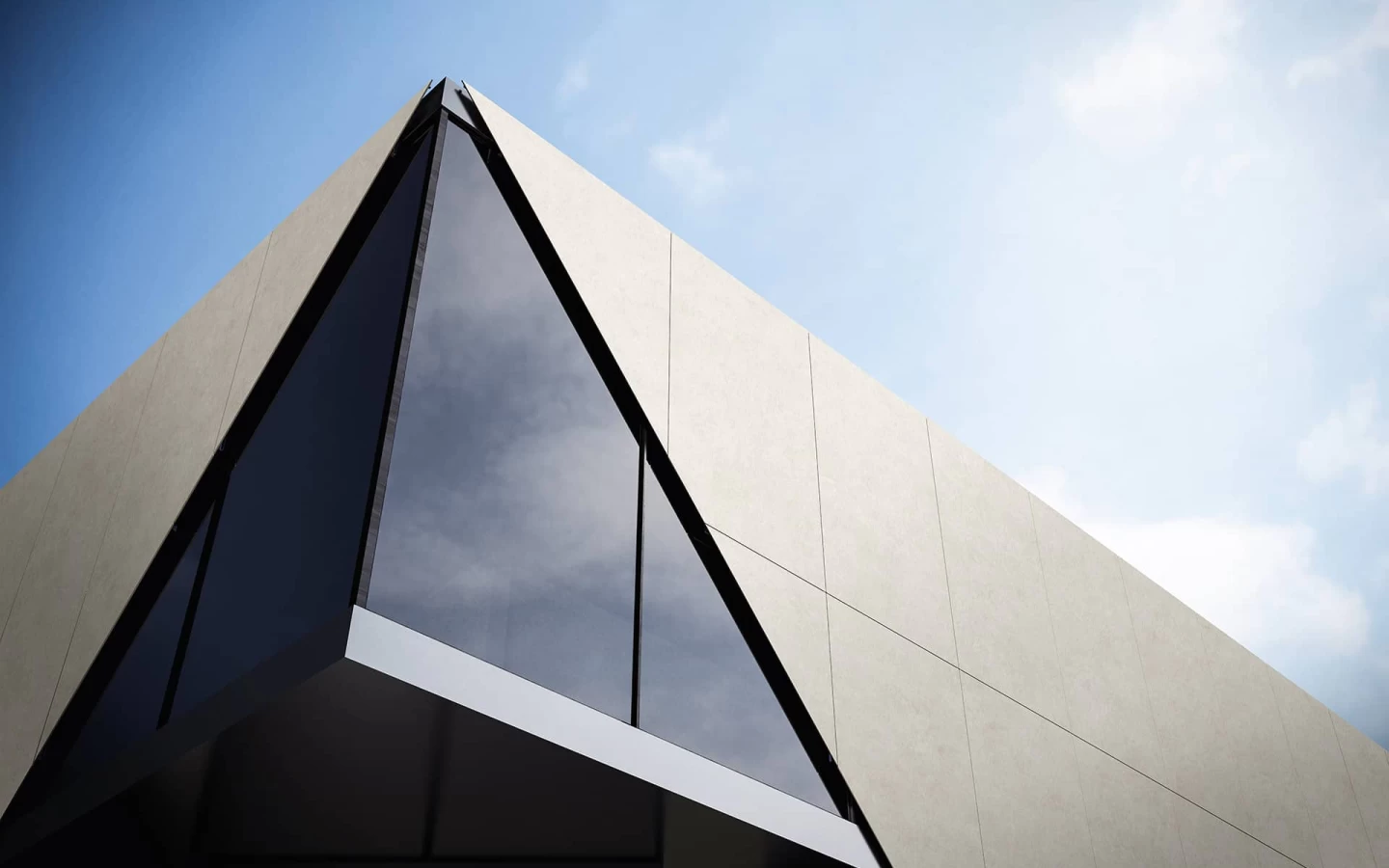 Close-up of the façade corner clad in Boost Vision Glow porcelain slabs, showcasing smooth surfaces with a subtle micro-textured finish.