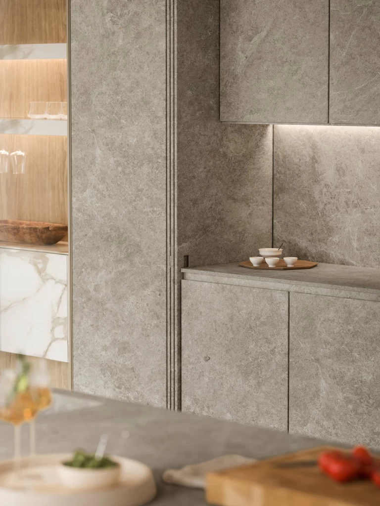 Detail of the Nyra Mist stone-look porcelain walls with matching finishes for a seamless, sophisticated effect.