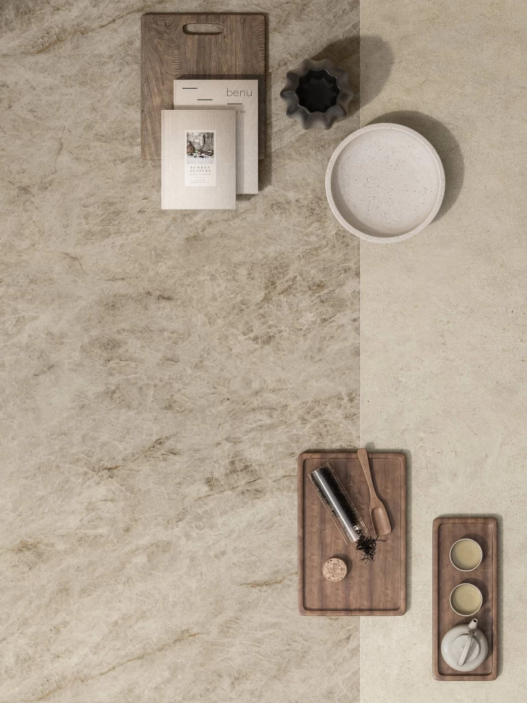 Top view of the Taj Mahal Noisette surface paired with light stoneware and wooden accessories.