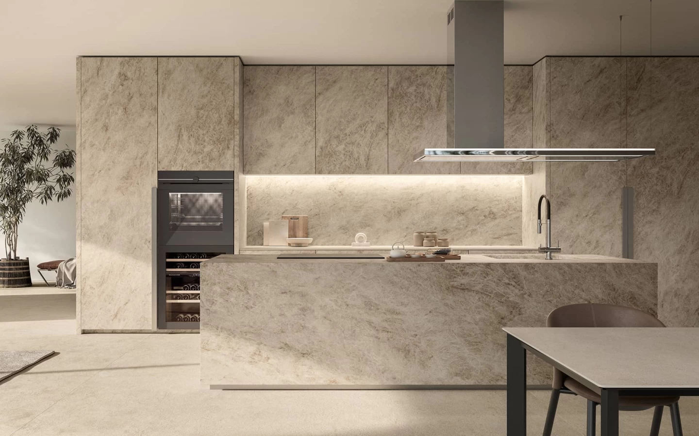 Front view of the kitchen island with worktop and backsplash in Taj Mahal Noisette, enhanced by elegant lighting.