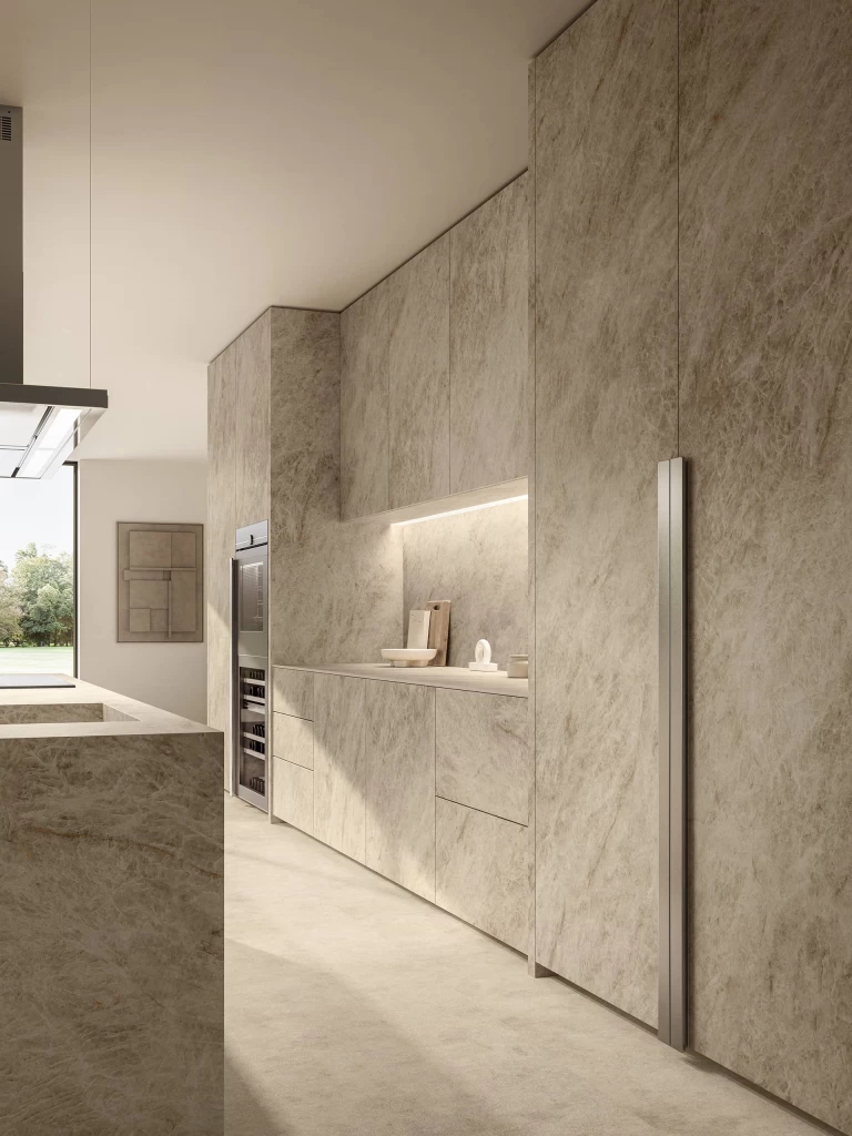 Walls and wall units clad in Taj Mahal Noisette for a minimalist, refined kitchen style.