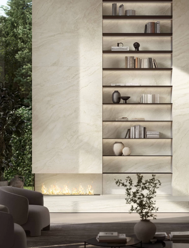 Detail of the fireplace and built-in shelving clad in Travertino Halo White marble-effect porcelain stoneware.