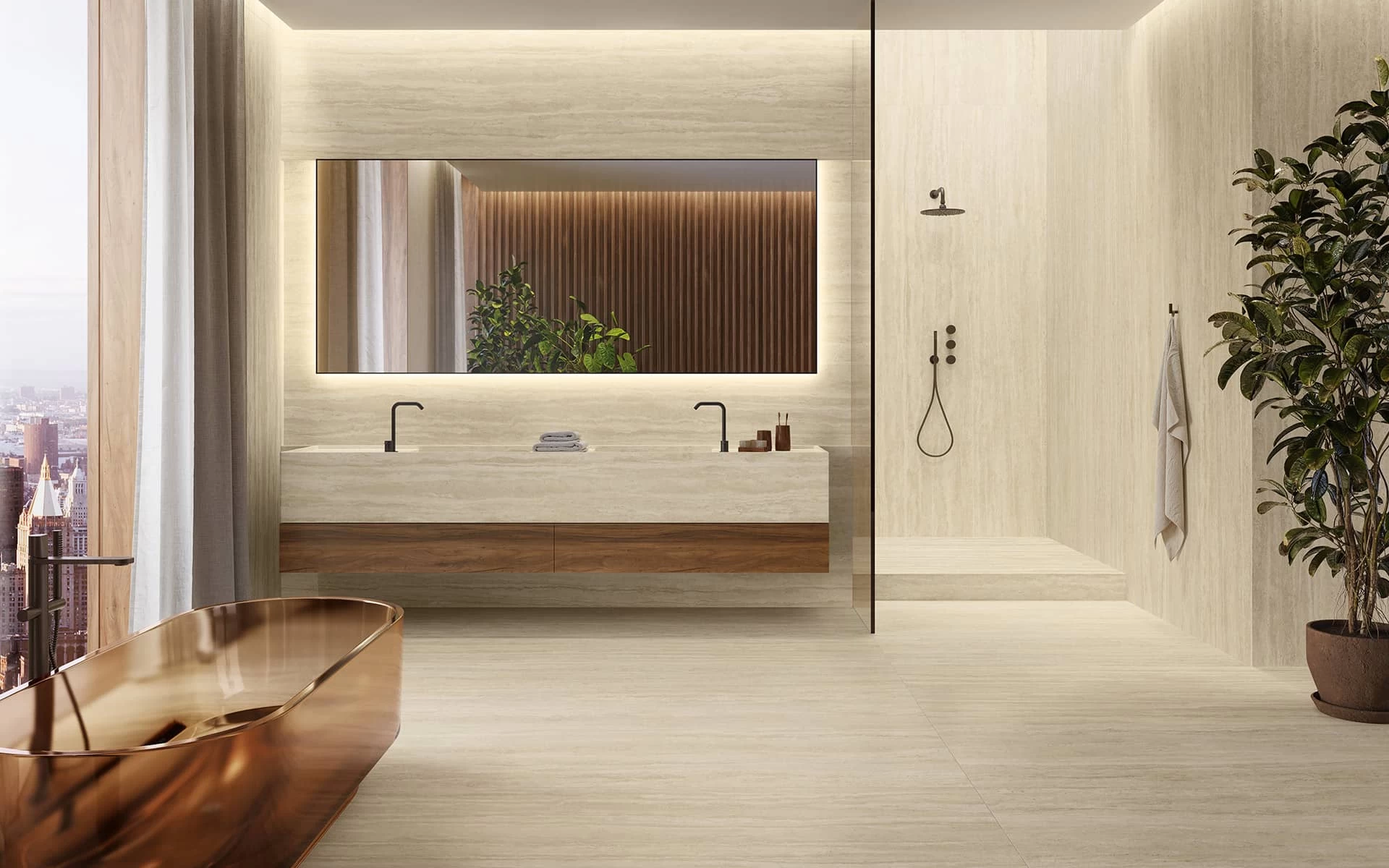 Modern bathroom featuring Travertino Romano Sand marble-effect porcelain stoneware, complemented by a bronze freestanding bathtub and a large backlit mirror.