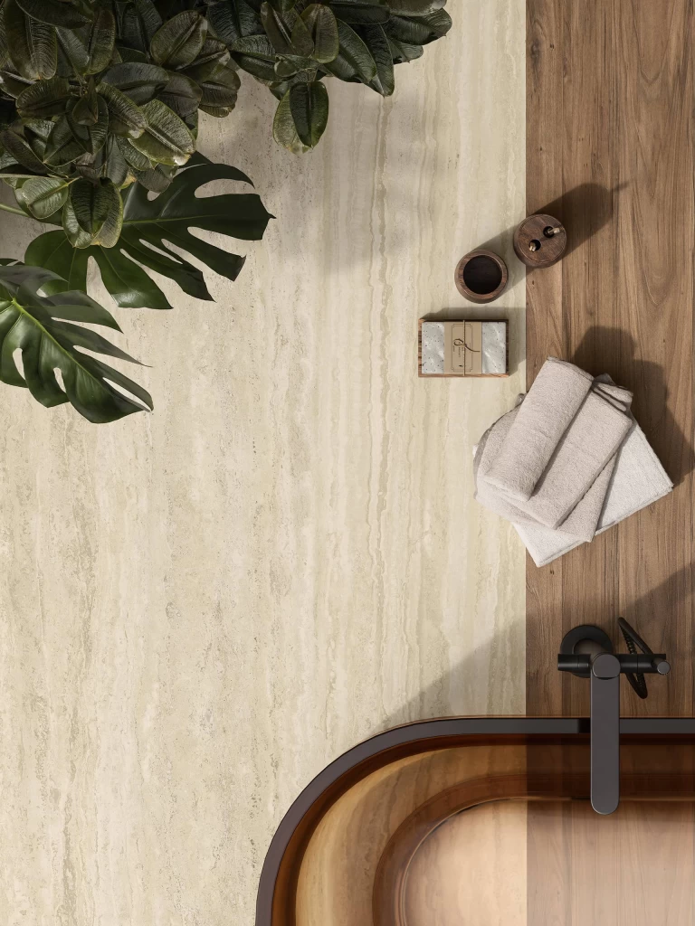 Design composition featuring a Travertino Romano Sand surface combined with modern bathroom accessories.