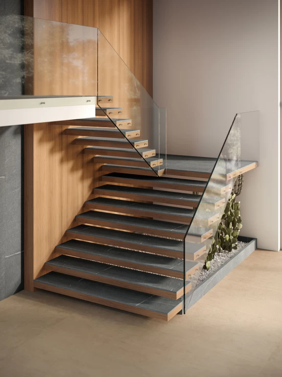 Escalera revestida en gres porcelánico efecto piedra– Atlas Plan