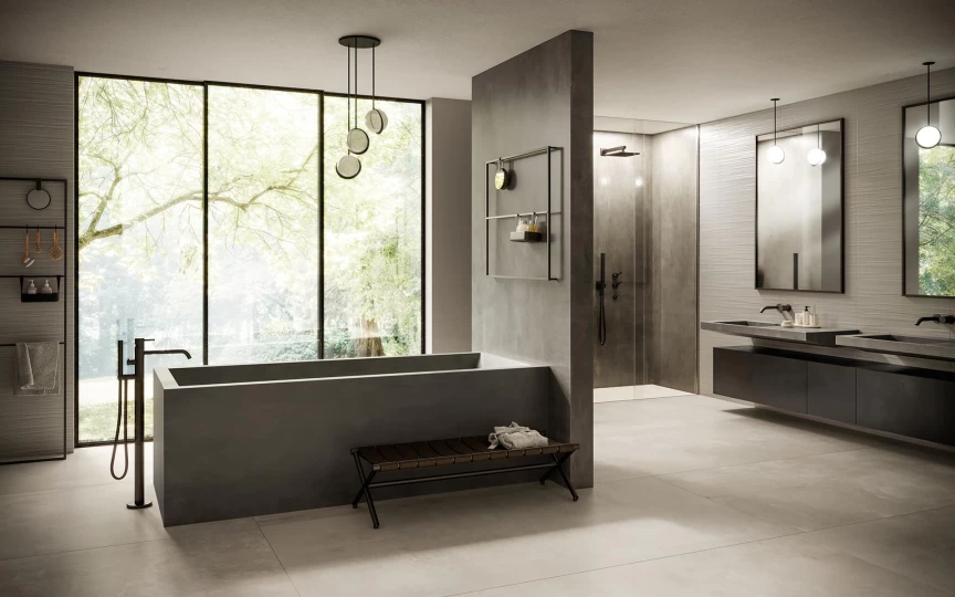 bagno moderno con rivestimenti in gres porcellanato effetto cemento Boost Smoke di Atlas Plan