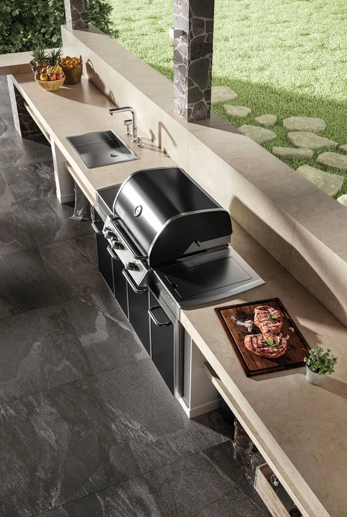 Modern outdoor kitchen with large format porcelain tile flooring