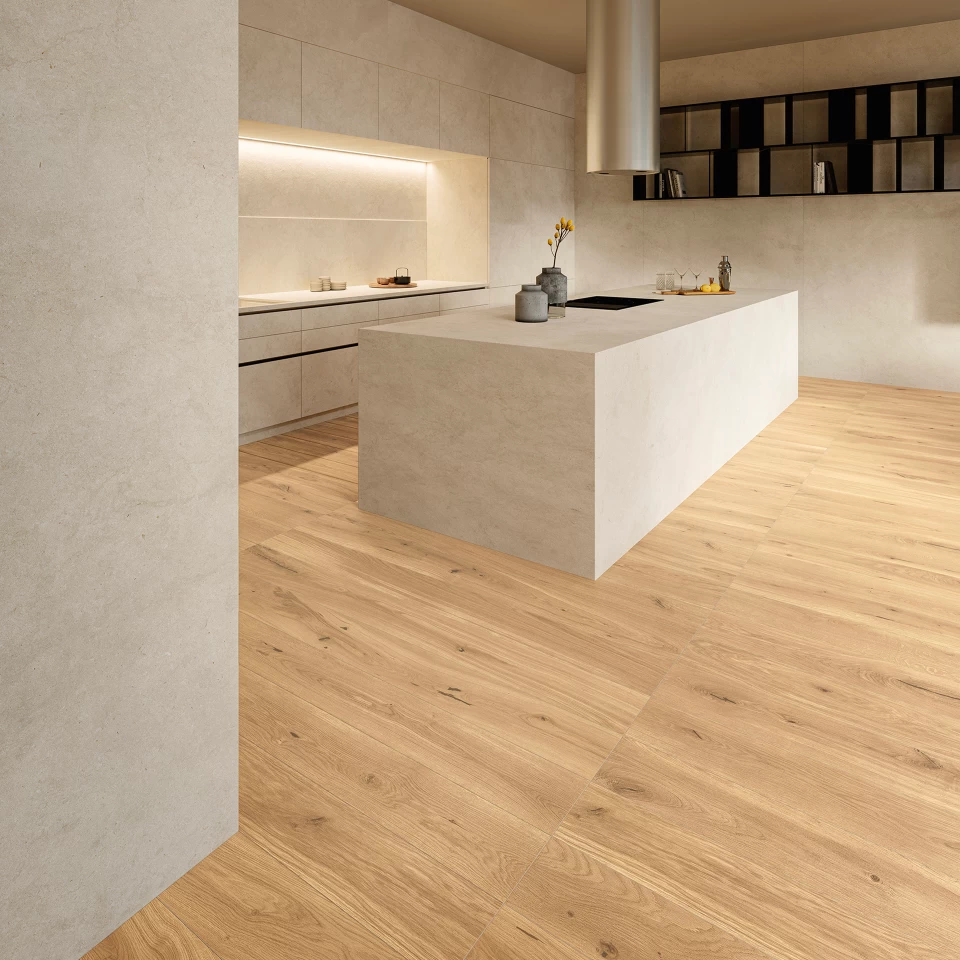 Monolithic kitchen with central island in porcelain stoneware and continuous surfaces