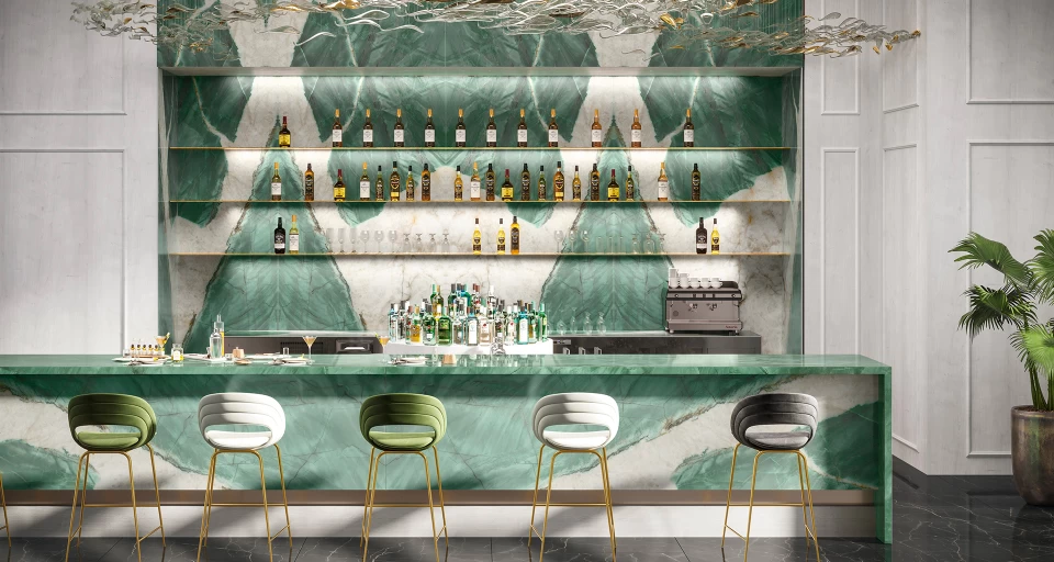 Bar counter with accent colour and continuous surfaces in Atlas Plan porcelain stoneware