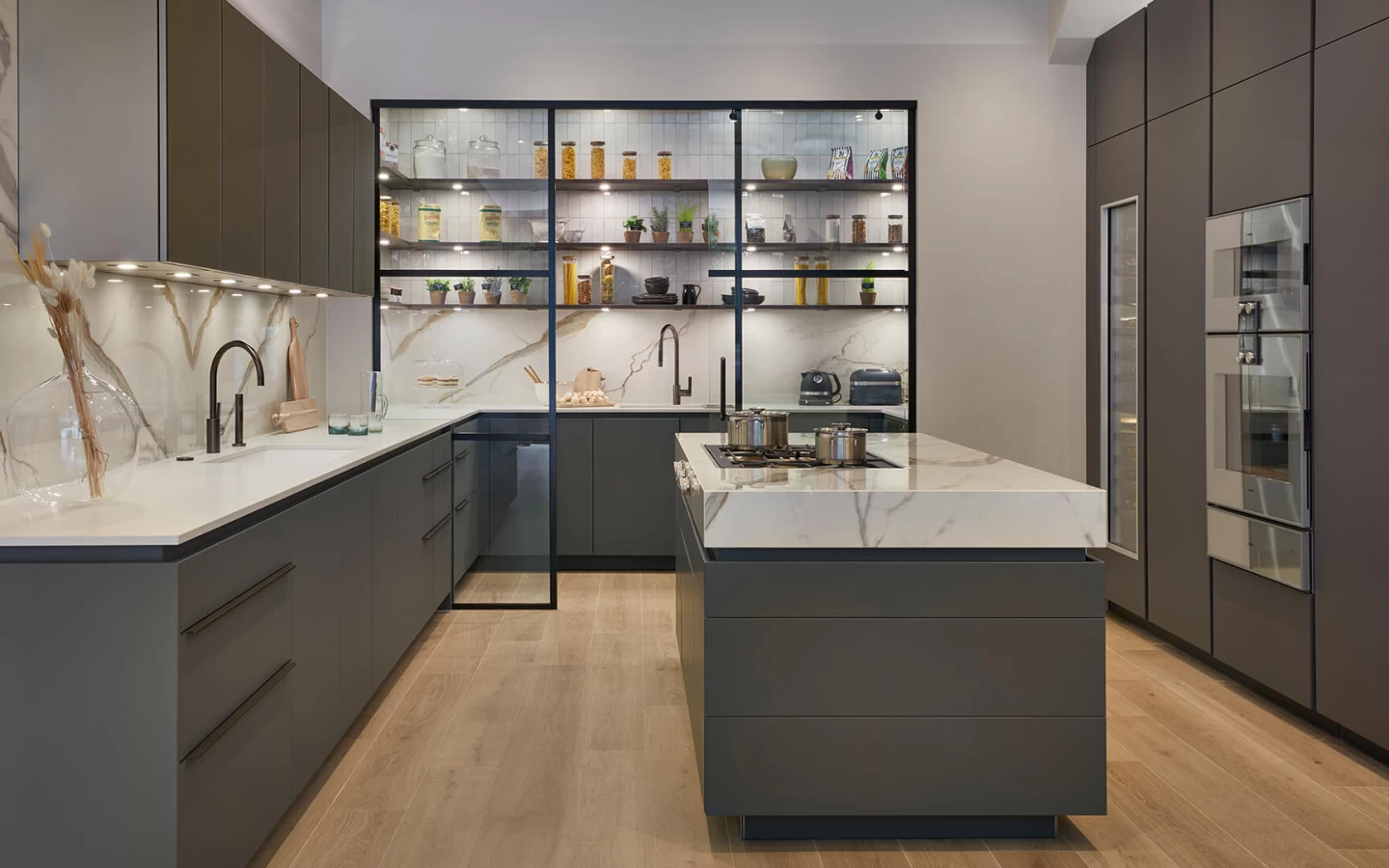 Showroom project with marble and concrete look stoneware kitchens by Atlas Plan